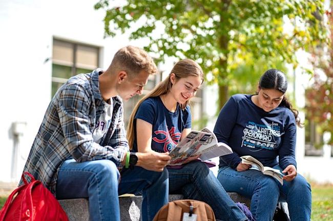 Students reading books together at the Saint Mary's College Summer Academy